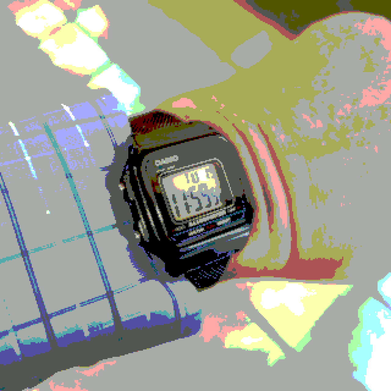 A CASIO W-217H wristwatch on a wrist in a low-resolution, low-color image