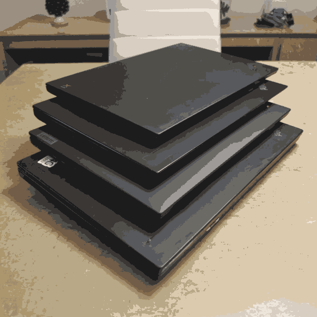 Modified image of a stack of thinkpads taken originally from https://old.reddit.com/r/thinkpad/comments/17xf8kl/my_thinkpad_stack/