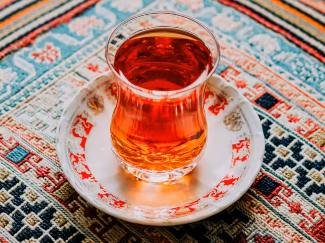 an Estakan-style teacup, courtesy of Mehrshad Rajabi from https://unsplash.com/photos/clear-turkish-tea-glass-BRVpzGwNzzI